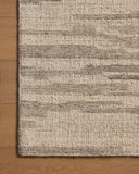 With shimmering silver and elegant grey hues and traditional styling, the Hartley HRT-02 Silver / Grey Area Rug is a hand-tufted wool area rug that elevates any room