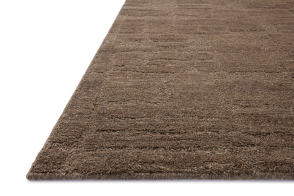 A stunning hand-tufted wool area rug with traditional detail, the Hartley HRT-04 Brown / Mocha Area Rug features brown and luxurious mocha tones for a polished look