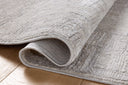A power-loomed polyester area rug with geometric design in elegant grey and refined ivory hues, the Hollis HOL-01 Grey / Ivory Area Rug is a standout in any décor
