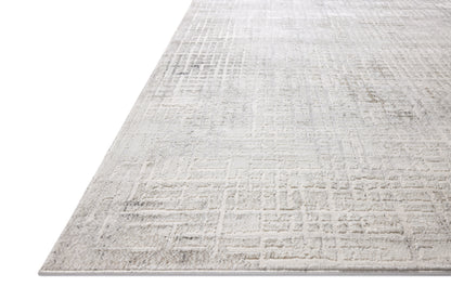 Dressed in refined ivory and grounding stone hues with geometric detail, the Hollis HOL-03 Ivory / Stone Area Rug is a power-loomed polyester area rug that completes any room