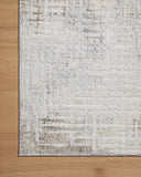 Dressed in refined ivory and grounding stone hues with geometric detail, the Hollis HOL-03 Ivory / Stone Area Rug is a power-loomed polyester area rug that completes any room