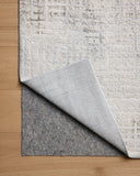 Dressed in refined ivory and grounding stone hues with geometric detail, the Hollis HOL-03 Ivory / Stone Area Rug is a power-loomed polyester area rug that completes any room
