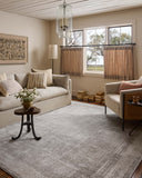 The Hollis HOL-04 Smoke / Mist Area Rug transforms any space with smoky and soft misty tones and geometric design in a power-loomed polyester area rug