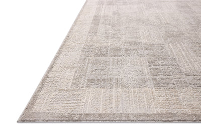 The Hollis HOL-04 Smoke / Mist Area Rug transforms any space with smoky and soft misty tones and geometric design in a power-loomed polyester area rug