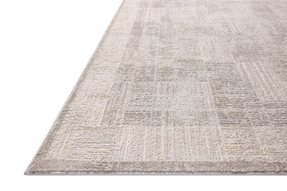 The Hollis HOL-04 Smoke / Mist Area Rug transforms any space with smoky and soft misty tones and geometric design in a power-loomed polyester area rug