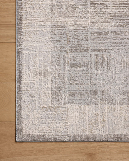 The Hollis HOL-04 Smoke / Mist Area Rug transforms any space with smoky and soft misty tones and geometric design in a power-loomed polyester area rug