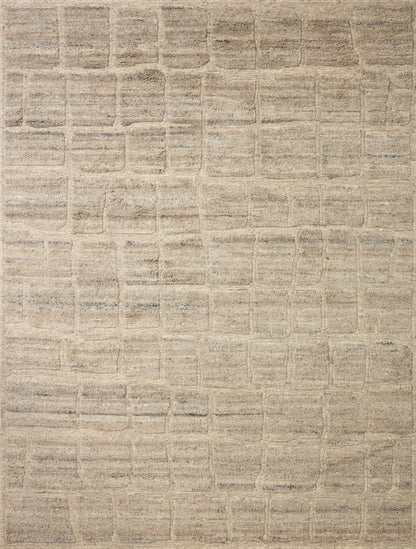 Dressed in gentle dove hues with graphic detail, the Hughes HUS-01 Dove Area Rug is a hand-knotted wool area rug that completes any room