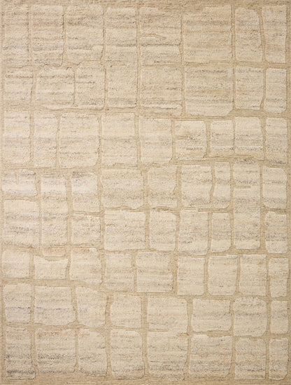 The Hughes HUS-01 Natural Area Rug transforms any space with warm natural tones and graphic design in a hand-knotted wool area rug