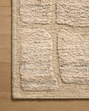 The Hughes HUS-01 Natural Area Rug transforms any space with warm natural tones and graphic design in a hand-knotted wool area rug