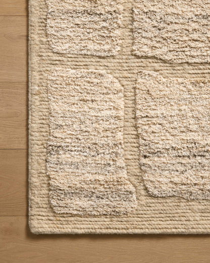 The Hughes HUS-01 Natural Area Rug transforms any space with warm natural tones and graphic design in a hand-knotted wool area rug