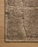 Layered in versatile taupe hues with graphic patterns, the Hughes HUS-01 Taupe Area Rug is a hand-knotted wool area rug perfect for any setting