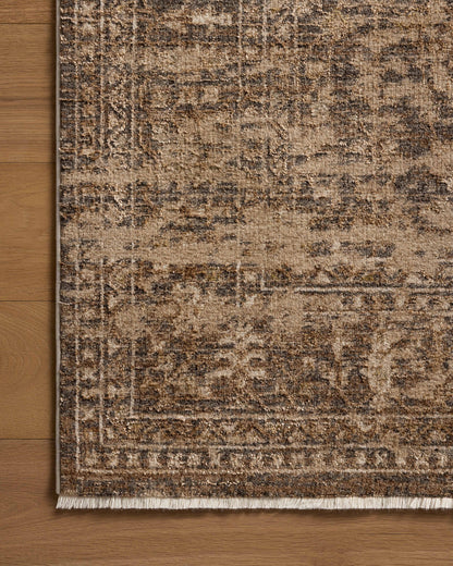 Designed with traditional and distressed artistry in striking granite and warm natural hues, the Haywood HYD-01 Granite / Natural Area Rug is a power-loomed polyester area rug that stands out