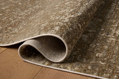 The Haywood HYD-01 Sage / Brown Area Rug combines calming sage and brown tones and traditional and distressed patterns in a power-loomed polyester area rug for effortless elegance