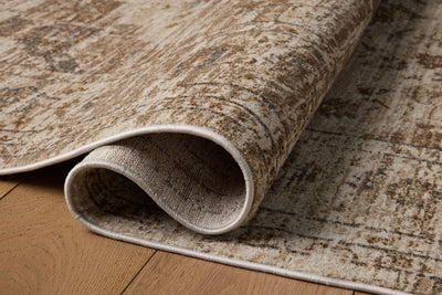 Finished in warm natural and grounded bark tones with traditional and distressed styling, the Haywood HYD-03 Natural / Bark Area Rug is a power-loomed polyester area rug for modern living
