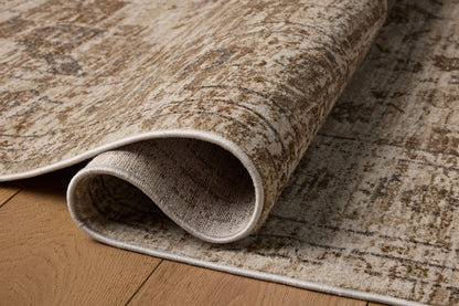 Finished in warm natural and grounded bark tones with traditional and distressed styling, the Haywood HYD-03 Natural / Bark Area Rug is a power-loomed polyester area rug for modern living