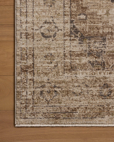 Finished in warm natural and grounded bark tones with traditional and distressed styling, the Haywood HYD-03 Natural / Bark Area Rug is a power-loomed polyester area rug for modern living