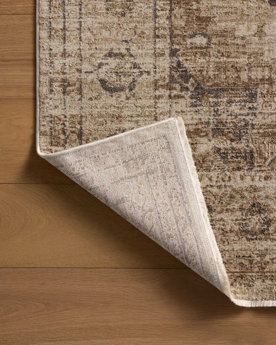 Finished in warm natural and grounded bark tones with traditional and distressed styling, the Haywood HYD-03 Natural / Bark Area Rug is a power-loomed polyester area rug for modern living