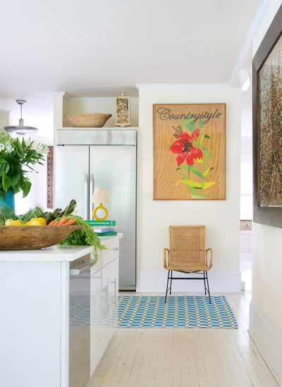 Icon ICN-1 Blue Area Rug in a bright kitchen with a blue and white checkered pattern.