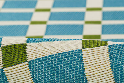Icon ICN-1 Blue Area Rug; close-up of blue, white, and green checkered woven pattern.