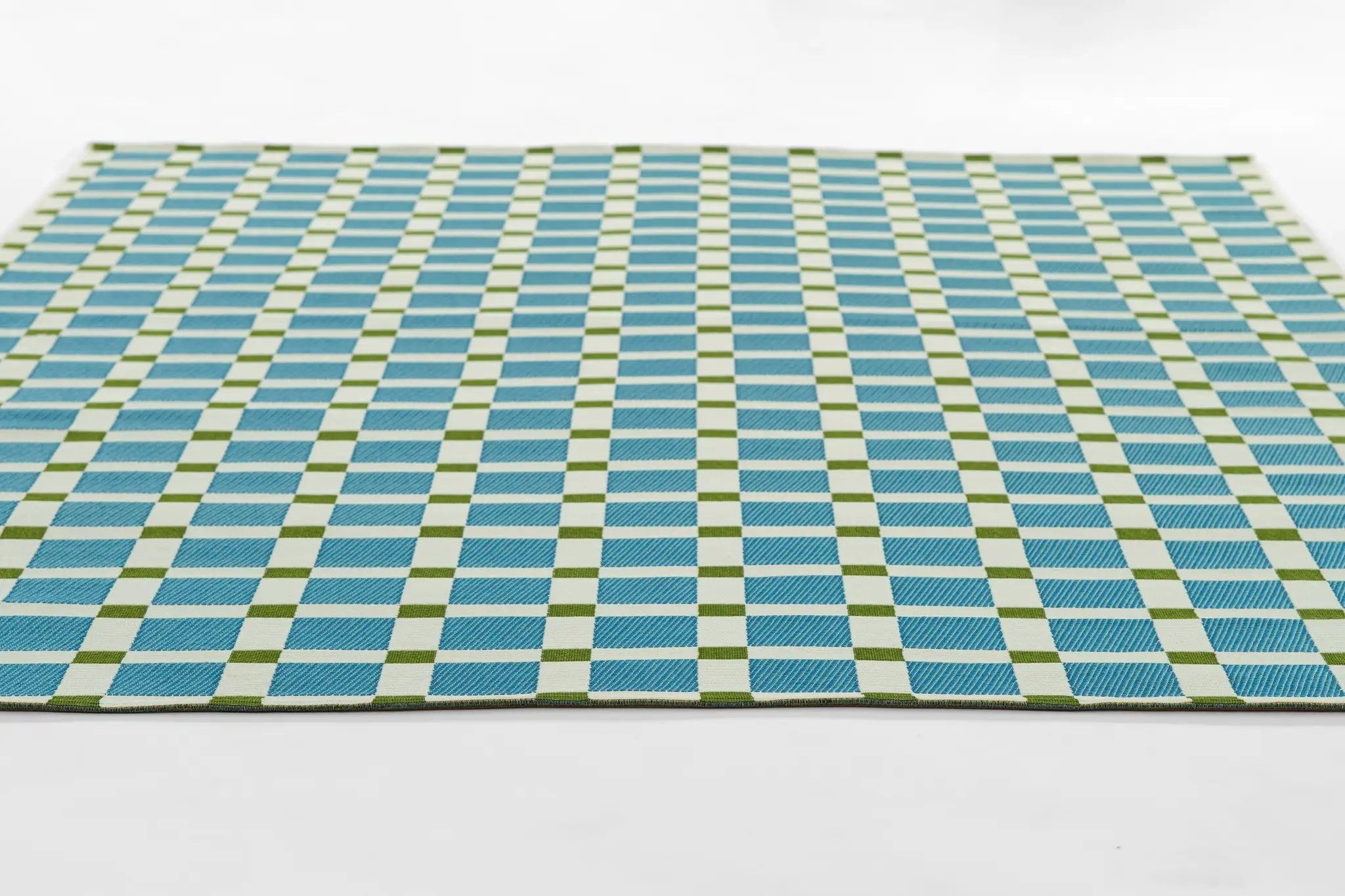 Icon ICN-1 Blue Area Rug featuring a blue and white geometric checker pattern with green accents, Mid-Century inspired.