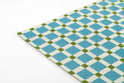 Icon ICN-1 Blue Area Rug from Novogratz x Momeni Icon Collection, blue and white checker with green accents.