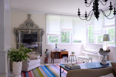 Icon ICN-2 Multicolor Area Rug with rainbow stripes, mid-century inspired, in a bright living room.
