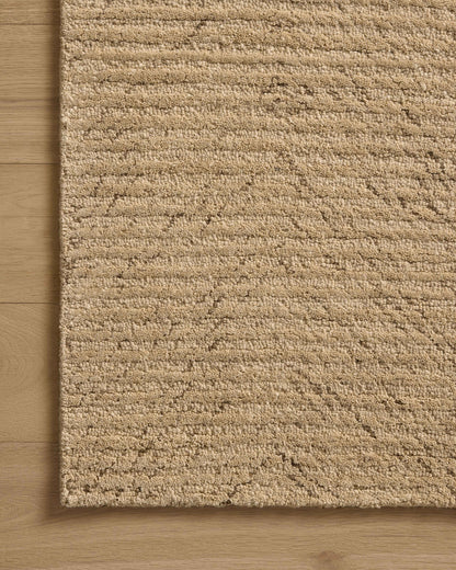 The Kai KAI-01 Beige Area Rug brings warm beige character and ribbed flair to your home in a hand-tufted wool area rug