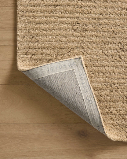 The Kai KAI-01 Beige Area Rug brings warm beige character and ribbed flair to your home in a hand-tufted wool area rug