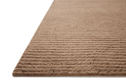 Finished in delicate blush tones with ribbed styling, the Kai KAI-01 Blush Area Rug is a hand-tufted wool area rug for modern living