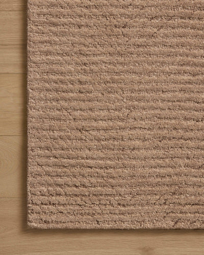 Finished in delicate blush tones with ribbed styling, the Kai KAI-01 Blush Area Rug is a hand-tufted wool area rug for modern living