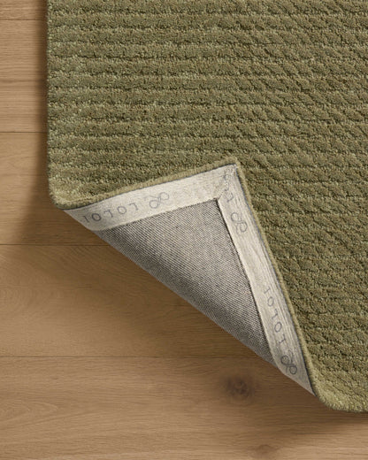 A hand-tufted wool area rug with ribbed design in earthy olive hues, the Kai KAI-01 Olive Area Rug is a standout in any décor
