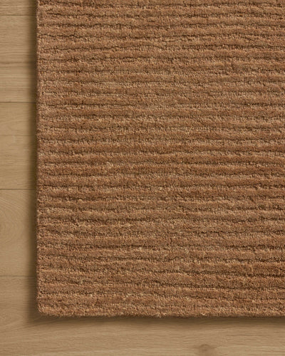 Dressed in rich terracotta hues with ribbed detail, the Kai KAI-01 Terracotta Area Rug is a hand-tufted wool area rug that completes any room