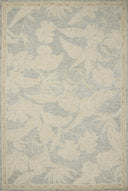 A hand-tufted wool area rug with floral flair in calming blue and warm natural tones, the Lenore LNO-01 Blue / Natural Area Rug anchors any room