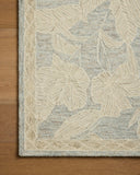 A hand-tufted wool area rug with floral flair in calming blue and warm natural tones, the Lenore LNO-01 Blue / Natural Area Rug anchors any room