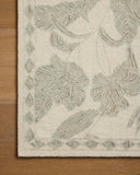 Crafted as a hand-tufted wool area rug, the Lenore LNO-01 Ivory / Sky Area Rug brings refined ivory and breezy sky-blue warmth and floral character to your space