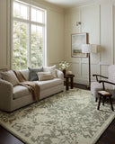 The Lenore LNO-02 Lagoon / Wheat Area Rug blends tranquil lagoon and golden wheat tones and floral motifs into a hand-tufted wool area rug with timeless appeal