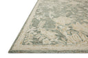 The Lenore LNO-02 Lagoon / Wheat Area Rug blends tranquil lagoon and golden wheat tones and floral motifs into a hand-tufted wool area rug with timeless appeal