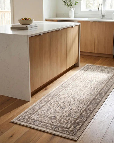 Arda ACZ-2301 Light Gray runner rug with an intricate pattern on a light wood floor in a kitchen.