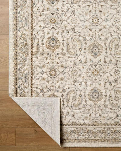 Close-up of the Arda ACZ-2301 light gray area rug with an intricate floral pattern and a folded corner.