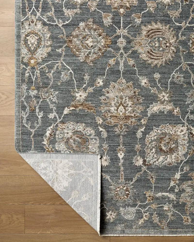 Close-up of the Arda ACZ-2305 Deep Teal Area Rug with a folded corner showing the backing.