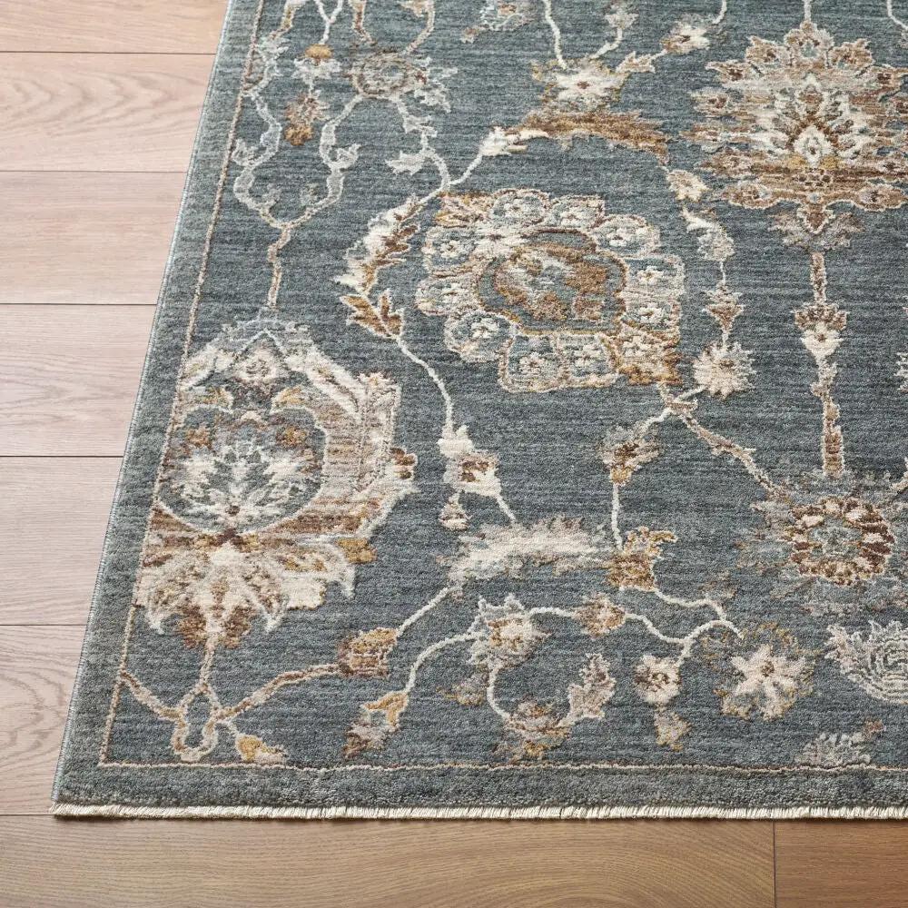 Close-up of the Arda ACZ-2305 Deep Teal Area Rug featuring floral patterns and a fringed edge.