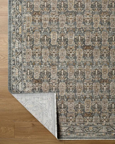 Close-up of the Arda ACZ-2309 Dark Green Area Rug showing its pattern and white backing on wood floor.