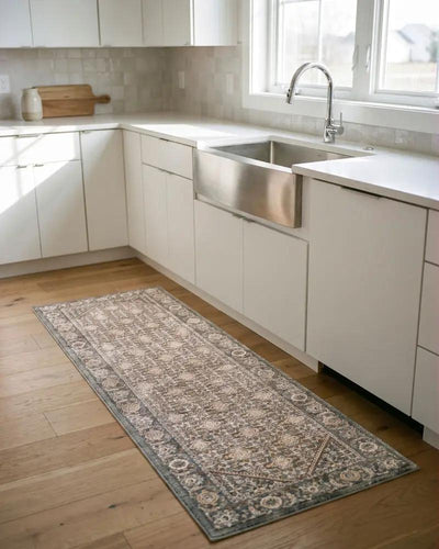 Arda ACZ-2314 Dark Green Area Rug runner on a light wood floor in a modern white kitchen.