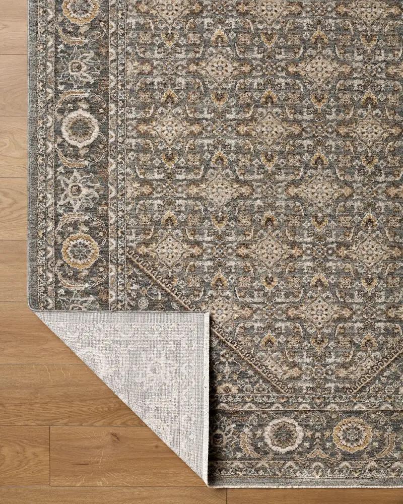 Close-up of the Arda ACZ-2314 Dark Green Area Rug showing its intricate pattern and folded corner.