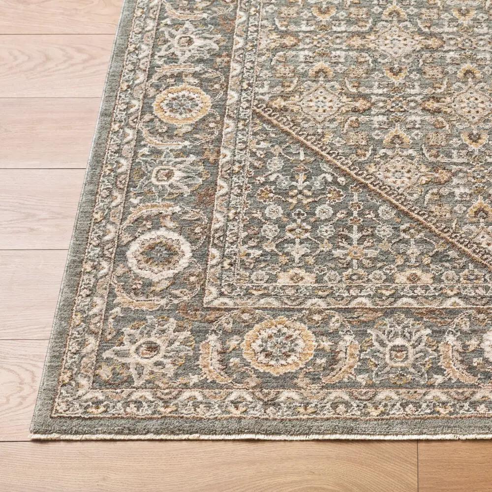 Close-up of the Arda ACZ-2314 Dark Green Area Rug featuring an intricate floral pattern and fringe.