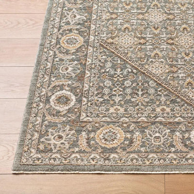 Close-up of the Arda ACZ-2314 Dark Green Area Rug featuring an intricate floral pattern and fringe.