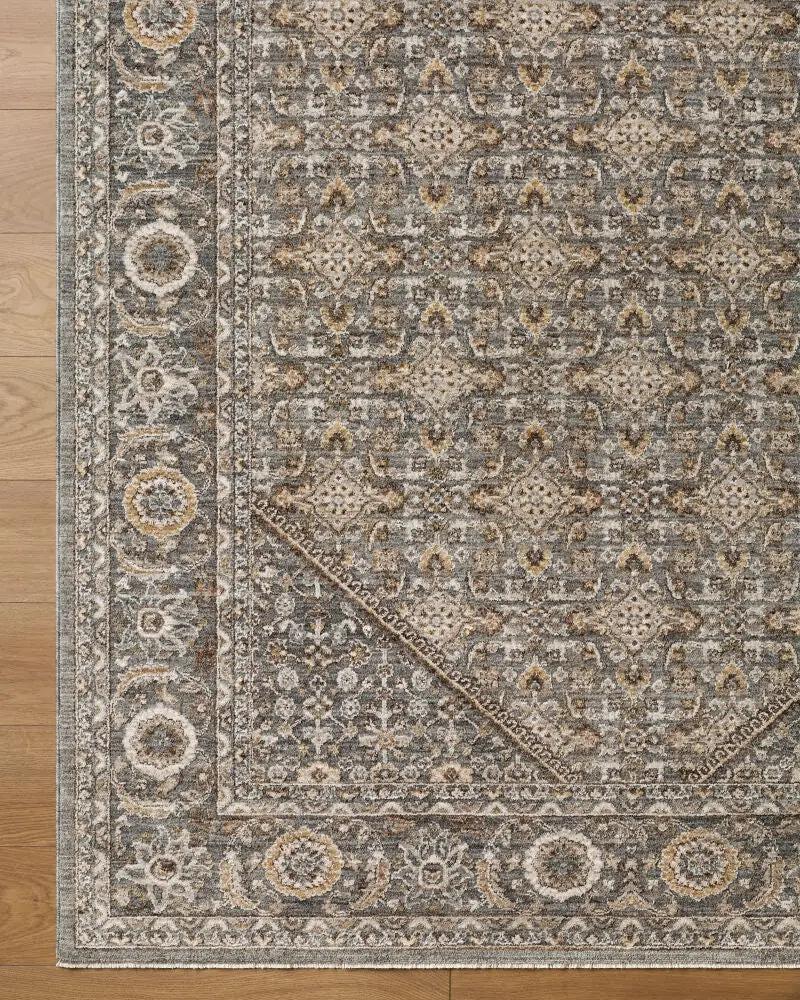Overhead view of the Arda ACZ-2314 dark green area rug with intricate patterns and fringe detail.