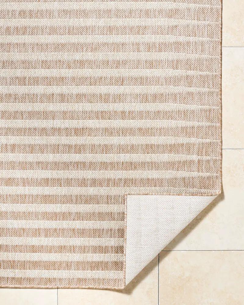 Tan and cream striped machine-woven Agave GAAG-2300 area rug with a folded corner showing the backing.
