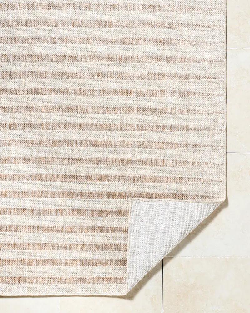 Close-up of the Agave GAAG-2301 Off-White Area Rug with a corner folded over to show the backing.