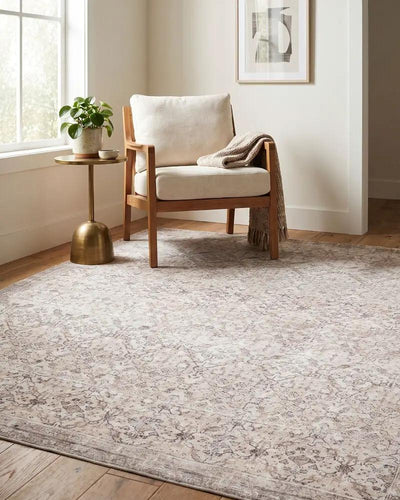 Amelia JYAL-2300 Blush Area Rug in a living room with a wooden chair and side table.
